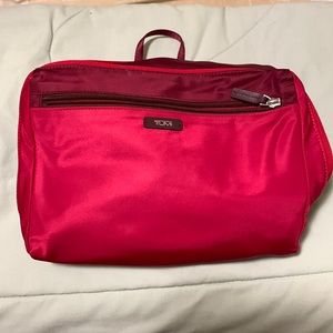 Tumi lightweight backpack can fold into a small pouch for travelling.